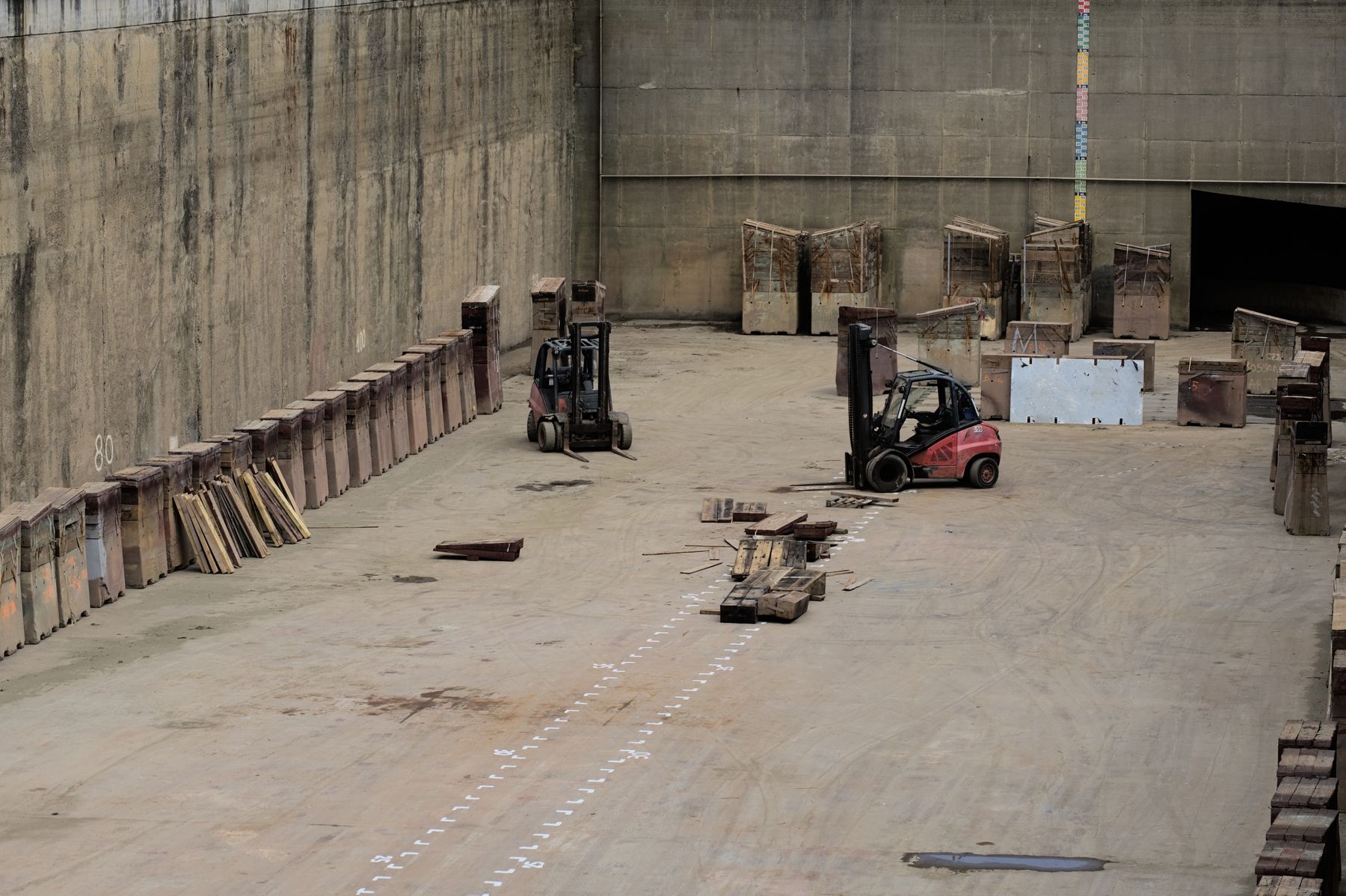 Heavy equipment and machinery lined up in an industrial rental yard