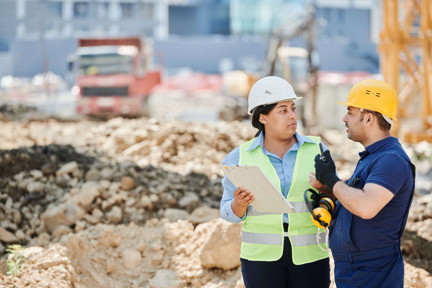 Team reviewing plans together on an industrial site